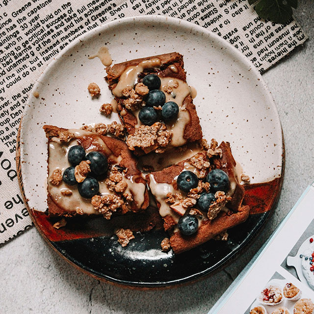 a plate with three square sweet tarts